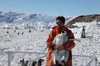 Stephanie Jenourvrier with emperor penguin chick